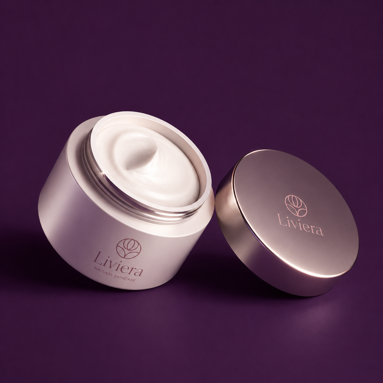Finished Liviera skincare packaging on a deep plum background